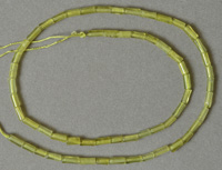Small yellow jade tube beads on strand.