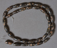 Small barrel beads from leopard skin jasper.